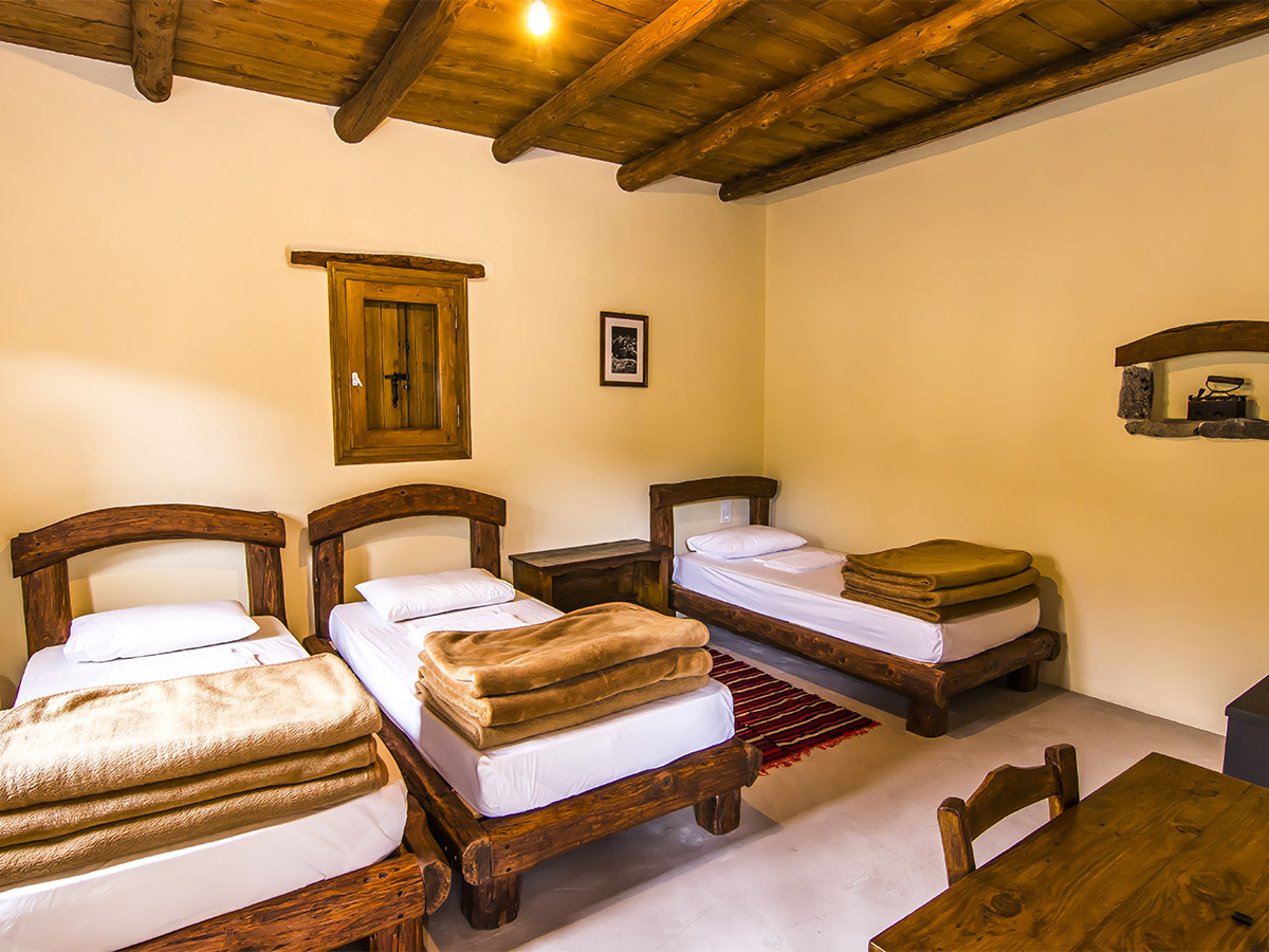Triple room with three handcrafted wooden beds