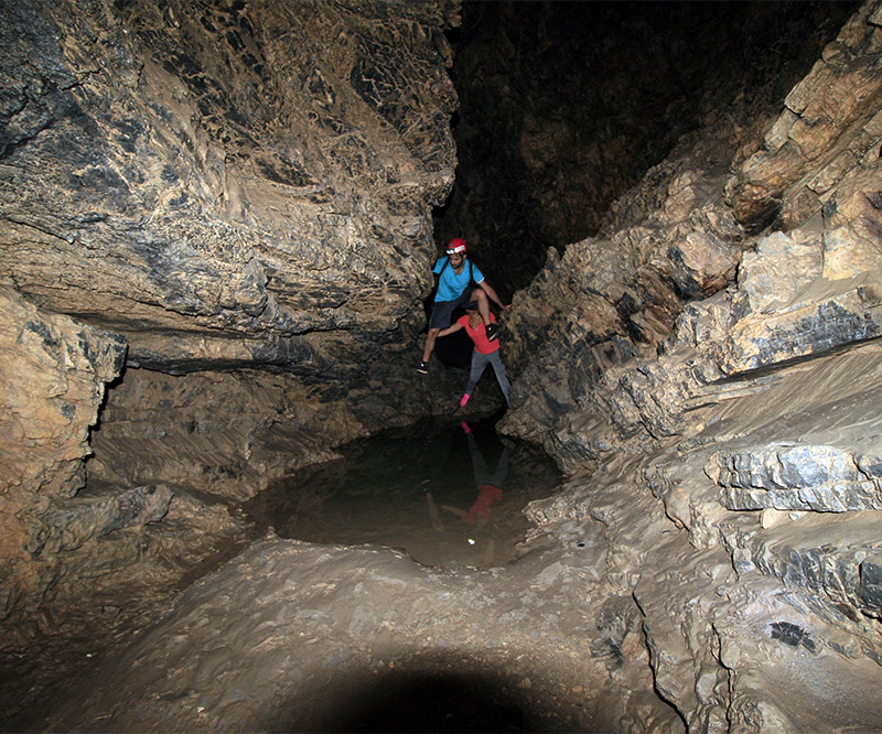 Exploring the underground passages of Drakoulaki Cave